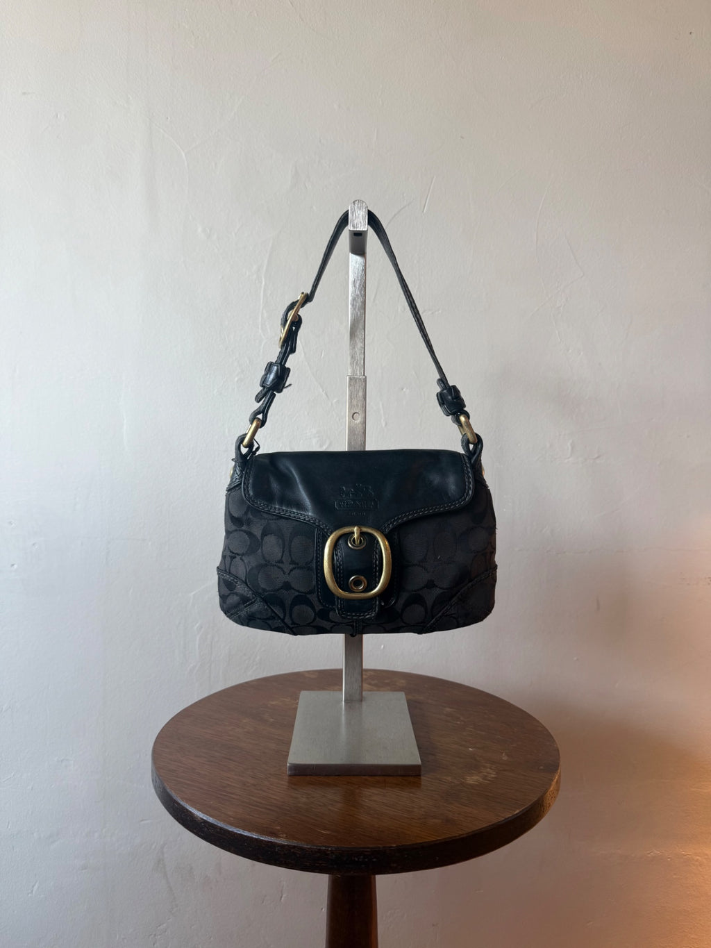 black with gold hardware coach monogram flap hobo